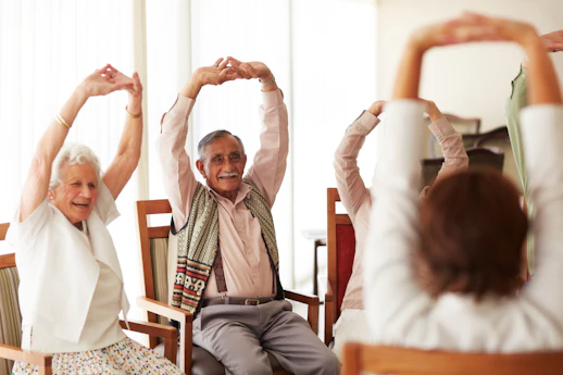 people stretching while sitting in chairs